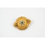 A VICTORIAN GOLD, EMERALD AND PEARL BROOCH the square-shaped emerald is set within a star motif of