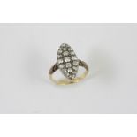 A VICTORIAN DIAMOND CLUSTER RING the marquise-shaped ring is millegrain set overall with graduated