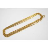 A GOLD MUFF CHAIN formed with oval-shaped punched-out links, 172cm long, 48.8 grams