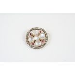 A VICTORIAN MOONSTONE, RUBY AND DIAMOND BROOCH of circular, foliate form, set with five cabochon