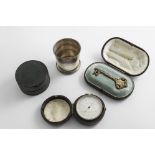 THREE CASED ITEMS:- An early 20th century American silver collapsible beaker by Gorham & Co., a