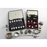 A MIXED LOT:- A cased set of six "slip-top" coffee spoons, a cased spoon & fork, a cased set of
