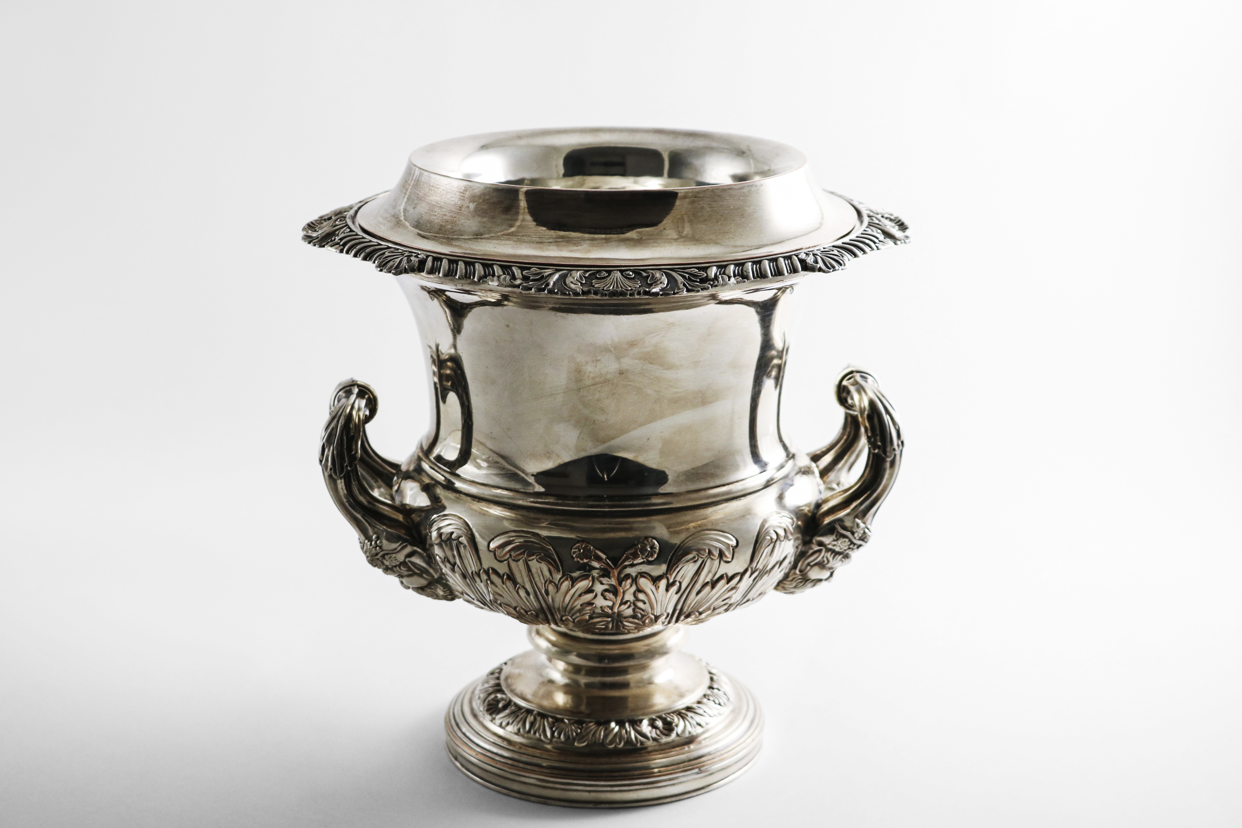 A PAIR OF LATE MIDDLE PERIOD OLD SHEFFIELD PLATED WINE COOLERS of campana form with embossed