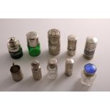 NINE VARIOUS EDWARDIAN AND LATER SILVER-MOUNTED GLASS TOILET & SMELLING SALTS BOTTLES some with