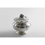 AN EARLY 19TH CENTURY TEA CADDY of baluster form, shaped circular outline with fluting, a domed