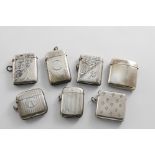 SEVEN EDWARDIAN AND SLIGHTLY LATER SILVER VESTA CASES (one with a later grille) of mixed designs (