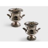 A PAIR OF LATE MIDDLE PERIOD OLD SHEFFIELD PLATED WINE COOLERS with waisted bodies, large scallop