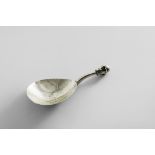 A GREAT WAR PERIOD ARTS & CRAFTS CADDY SPOON with a hammered bowl, a square-section stem and an