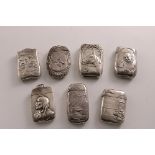 SEVEN VARIOUS LATE 19TH / EARLY 20TH CENTURY NORTH AMERICAN SILVER EMBOSSED VESTA CASES:- One with a