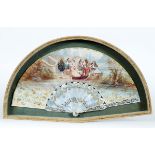 A FRENCH FAN with mother of pearl guards & sticks, engraved and gilt with trailing ivy, the paper