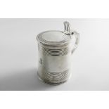 A GEORGE II TANKARD of slightly tapering cylindrical form with bands of incised, reeded