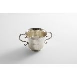 A LATE 18TH CENTURY CHANNEL ISLES TWO-HANDLED CUP with a campana-shaped body and twin, beaded s-