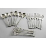 AN EARLY 20TH CENTURY COLLECTED PART SET OF HANDMADE FLATWARE TO INCLUDE:- Six dessert spoons and