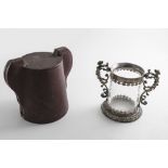 A 19TH CENTURY MOUNTED ROCK CRYSTAL CUP with a cylindrical body, twin caryatid scroll handles and an