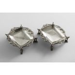 A PAIR OF EARLY 20TH CENTURY HANDMADE DISHES of shaped rectangular outline with a hammered finish,