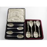 A CASED SET OF FOUR LATE VICTORIAN PARCELGILT FRUIT SERVING SPOONS with embossed decoration, by