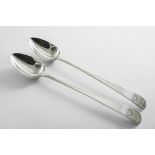 A PAIR OF GEORGE III IRISH BASTING OR SERVING SPOONS with bright-cut bordered stems, crested, by