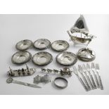 A MIXED LOT:- A set of six saucers by William Comyns, London 1892/93/96, an ash tray (loaded), a