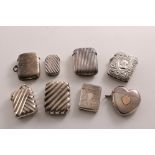 EIGHT VARIOUS LATE VICTORIAN SILVER VESTA CASES including a heart-shaped example with an applied
