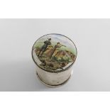 A VICTORIAN CYLINDRICAL DRESSING TABLE BOX the hinged cover enamelled in polychrome with a lady &