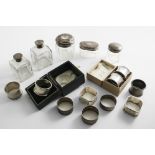 A MIXED LOT:- Five various mounted glass bottles/jars, a napkin ring (boxed), a pair of waisted