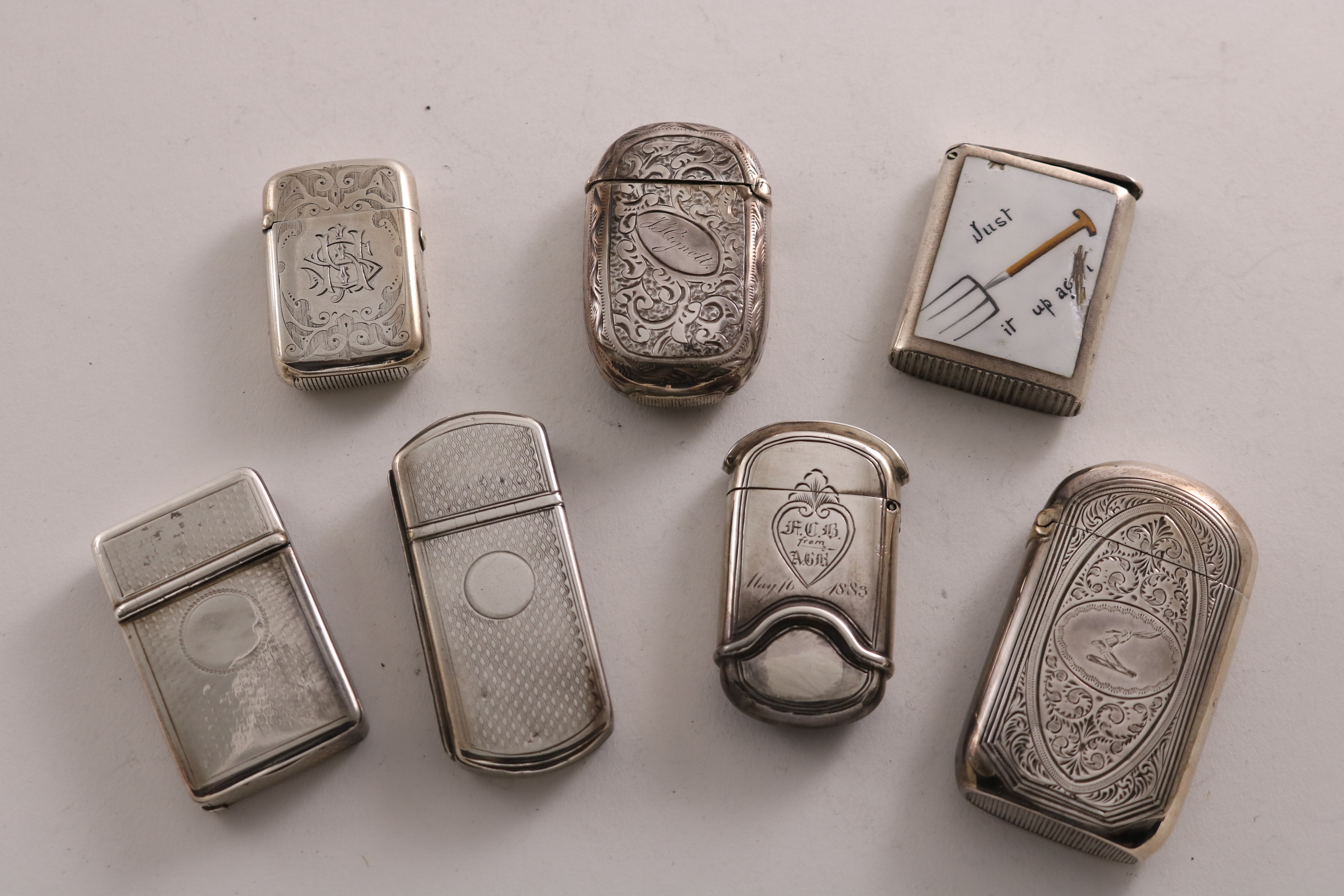 MISCELLANEOUS VESTA CASES:- A Victorian silver, early dual compartment vesta case with a cutter at