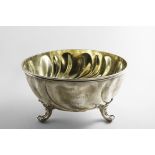 AN EARLY 20TH CENTURY GERMAN ROSE BOWL with swirl-fluted decoration, three cast husk & scroll feet