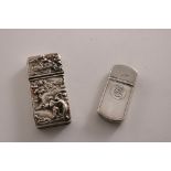 A VICTORIAN SILVER EARLY VESTA / TINDER BOX with dual compartments, decorated in relief on the