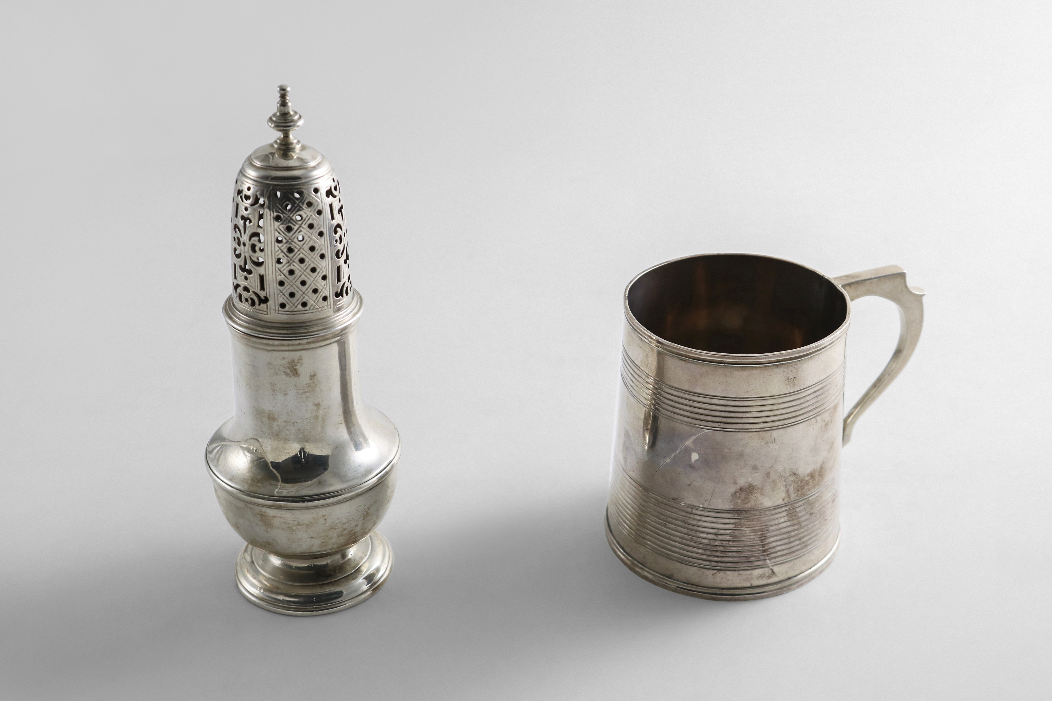 A GEORGE II SILVER VASE-SHAPED CASTER with a high-domed cover & knop finial, by Samuel Wood,