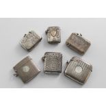 SIX VARIOUS EDWARDIAN & LATER SILVER VESTA CASES of mixed designs, including one with applied gold