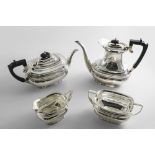 A LATE 20TH CENTURY FOUR-PIECE TEA & COFFEE SET with rounded rectangular bodies, angular handles and