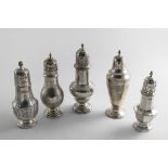 A SMALL COLLECTION OF FIVE VARIOUS SILVER SUGAR CASTERS mixed designs, makers and dates,