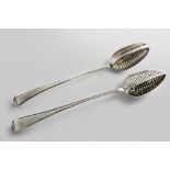A GEORGE III OLD ENGLISH PATTERN STRAINER SPOON with a slot-pierced divider, crested, by Samuel