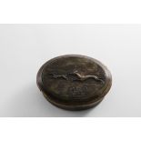 A RARE EARLY 18TH CENTURY OVAL PRESSED HORN BOX the lift-off cover impressed with a hare coursing