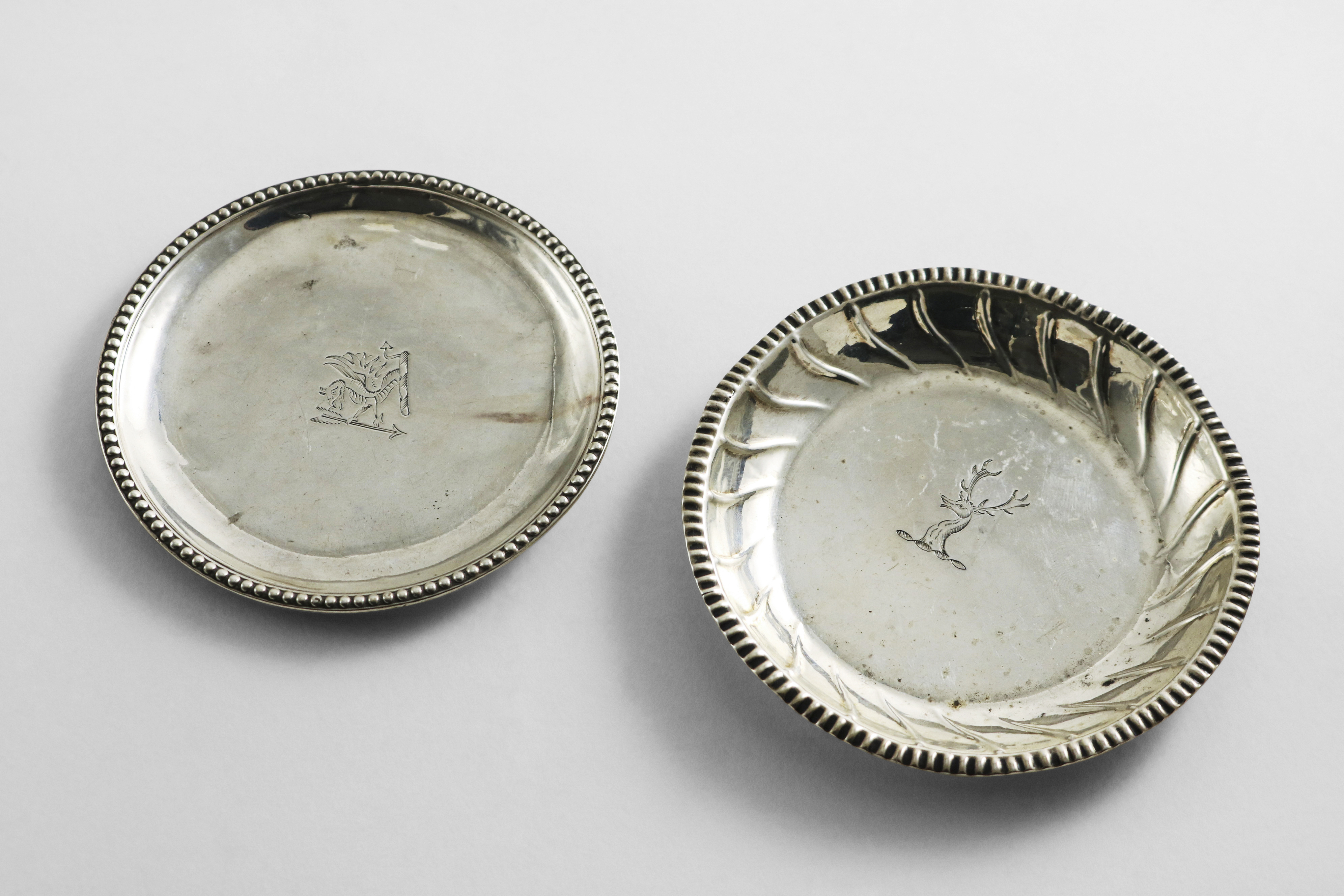 A GEORGE III IRISH PROVINCIAL COUNTER TRAY with a bead border, crested, by Carden Terry of Cork (