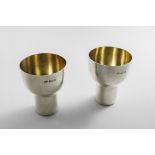 A PAIR OF LATE 20TH CENTURY GOBLETS in a pure functional form with gilt interiors, by Paul Harrison,