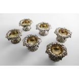 A WILLIAM IV SET OF SIX NATURALISTIC SALTS on shaped circular, foliate bases, the circular bowls