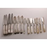 A SMALL COLLECTION OF SILVER BUTTER KNIVES mixed dates & makers, Victorian-Edwardian (including