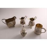 A MIXED LOT OF SILVER:- A George III Irish cream jug on ball feet, initialled, a Victorian