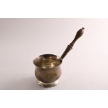 AN EARLY GEORGE III SILVER BRANDY SAUCE PAN with a turned wooden handle, a baluster body & a
