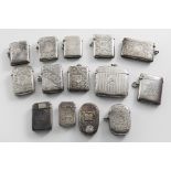 FOURTEEN VARIOUS LATE VICTORIAN / EDWARDIAN SILVER VESTA CASES all with initials / monograms, by