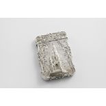 A VICTORIAN SILVER EMBOSSED "CASTLE TOP" CARD CASE of shaped rectangular outline with scroll borders