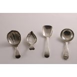 A GEORGE III SILVER CADDY SPOON with a leaf-shaped bowl and an engraved border, initialled, by