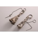 TWO VICTORIAN SILVER POSY HOLDERS with embossed floral decoration, both unmarked; each approx. 5" (