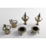 AN EARLY 20TH CENTURY SIX-PIECE CONDIMENT SET circular with foliate shell borders, the salts and