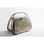 A VICTORIAN ELECTROPLATED NOVELTY BISCUIT BOX resembling a handbag with engraved decoration and