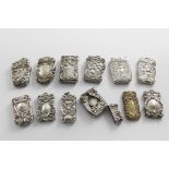 TWELVE LATE 19TH / EARLY 20TH CENTURY NORTH AMERICAN SILVER ART NOUVEAU VESTA CASES with embossed