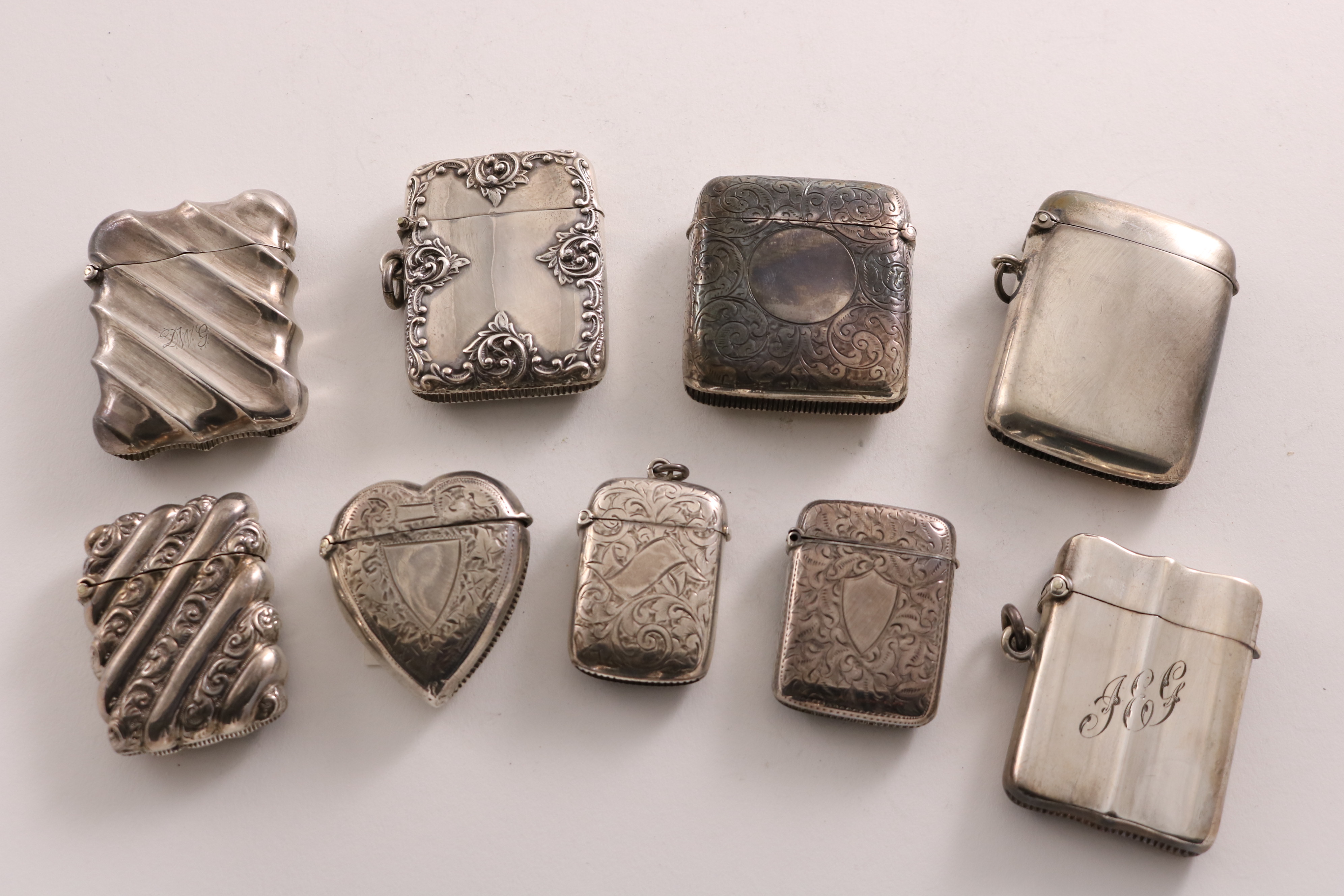 NINE VARIOUS LATE VICTORIAN / EDWARDIAN VESTA CASES OF MIXED DESIGNS (two initialled), by various