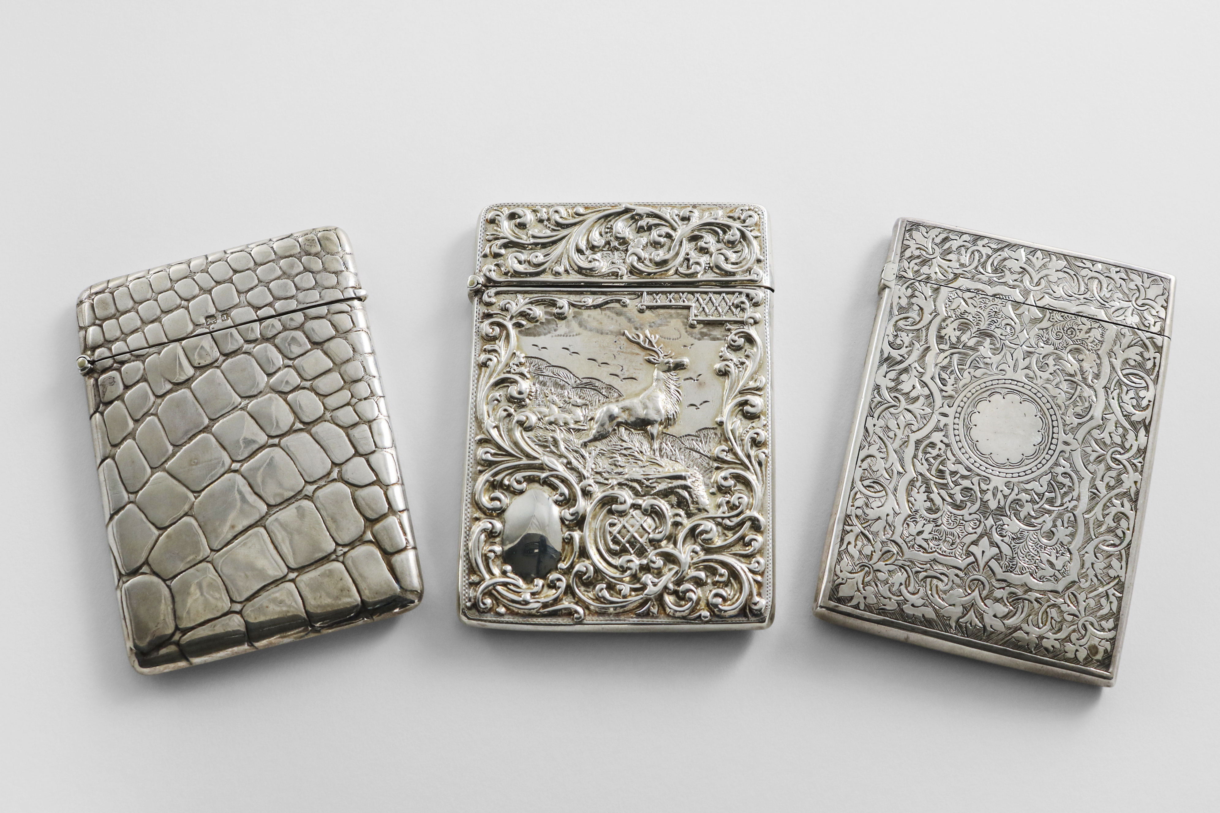 AN EDWARDIAN SILVER CARD CASE with simulated crocodile-skin texturing, by W. H. Sparrow,