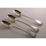 A GEORGE IV SILVER FIDDLE PATTERN BASTING SPOON crested, by James Wintle, London 1824, another